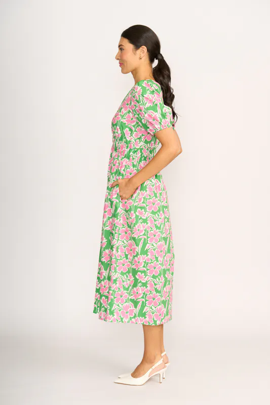 Model wearing Blossom Pop Dress - Shirred Empire Line By Foil Available at Beetees Nelson