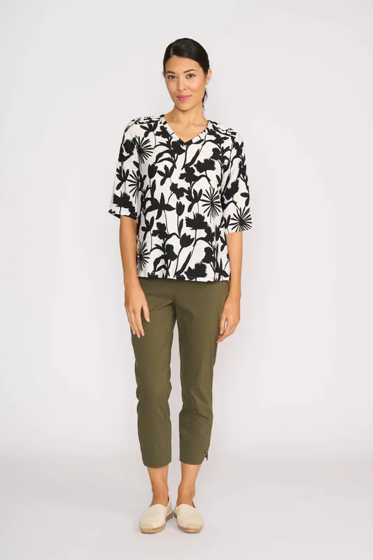 Model wearing Silhouette Pintuck Scoop Hem Top By Foil Available at Beetees Nelson