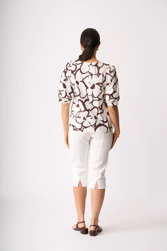 Model wearing Upsa-Daisy Scoop Neck Swing Top By Foil Available at Beetees Nelson