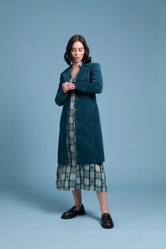 Model wearing Malachite Coloured Strike A Cord Coat By Siren Available at Beetees Nelson