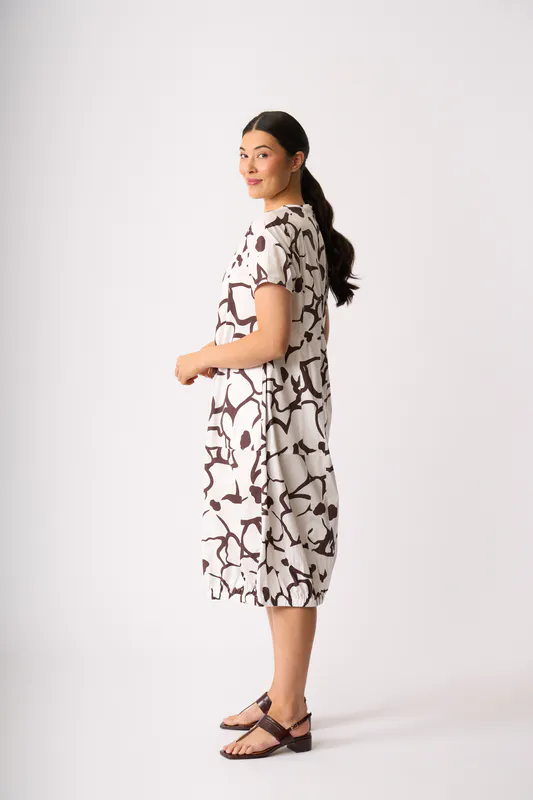 Model wearing Uspa- Daisy Pleated Maxi Dress By Foil Available at Beetees Nelson