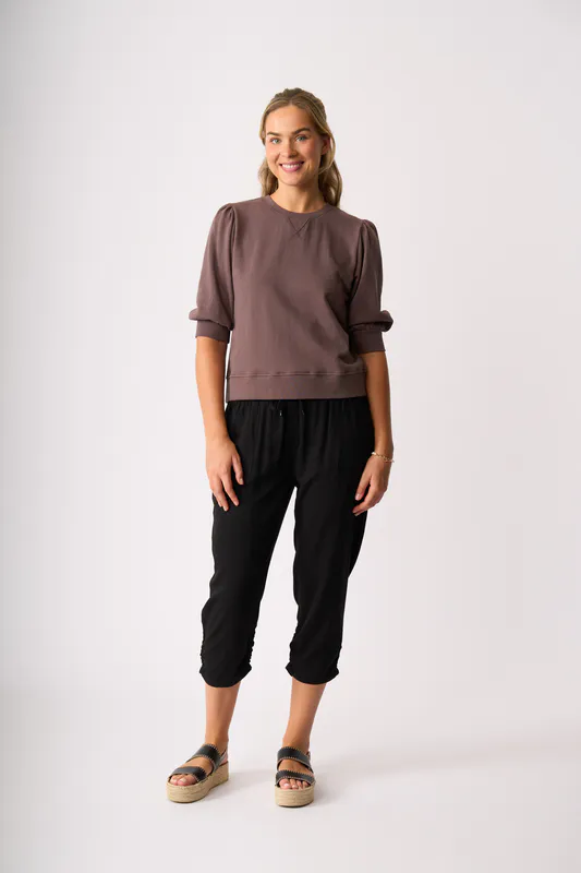 Model wearing Black Draped Cuff Trousers By Memo Available at Beetees Nelson
