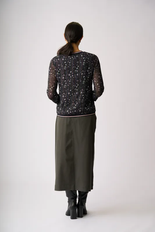 Model wearing Twilight Floral Sheer Sleeve, Rib Detail Top By Memo Available at Beetees Nelson