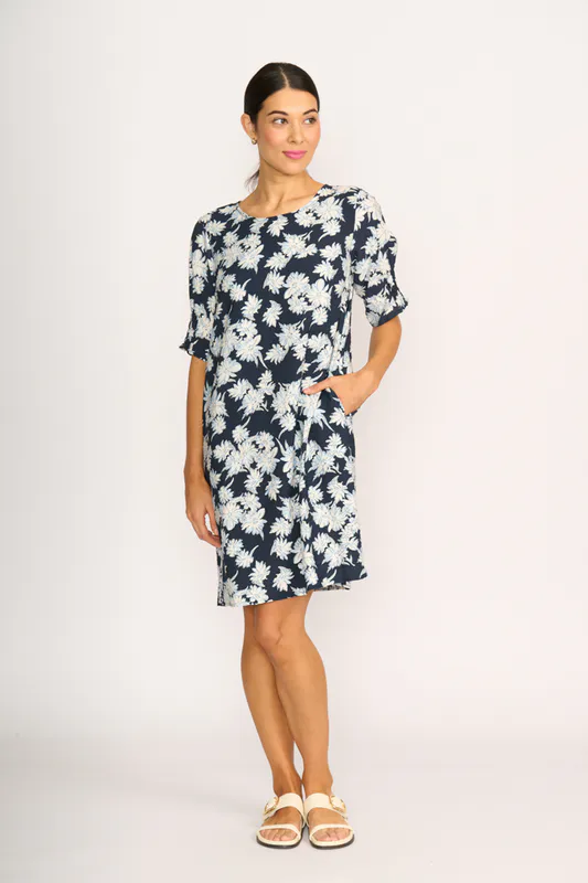 Model wearing Navy Sketch Floral Dress - Shirr The Cuff By Foil Available at Beetees Nelson