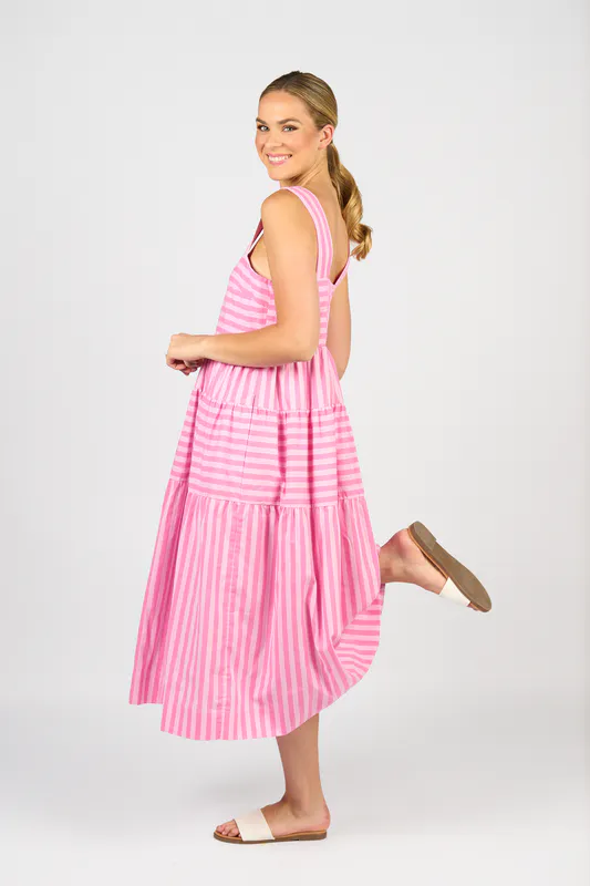 Model wearing Pink Stripe Sleeveless Tiered Dress with Wide Straps By Vassalli Available at Beetees Nelson