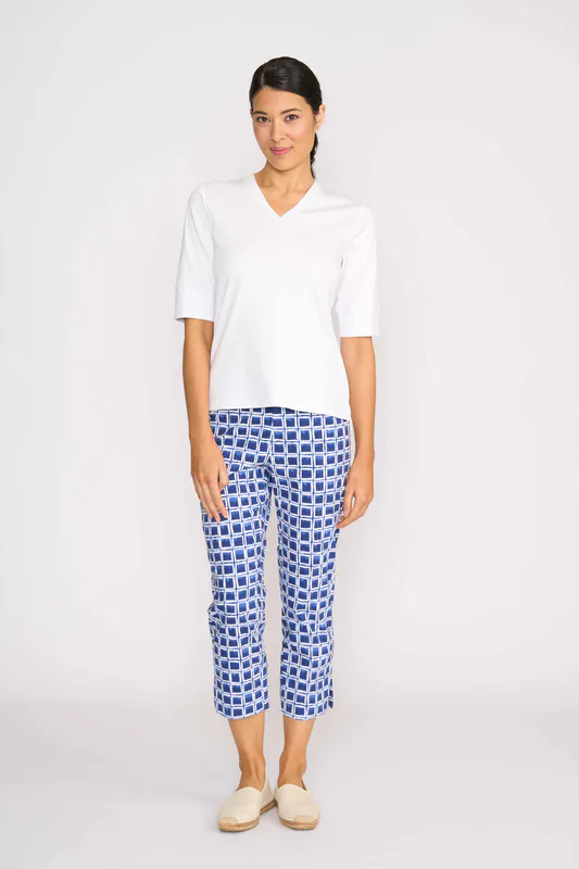 Model wearing White Slim V Neck Top By Esplanade Available at Beetees Nelson