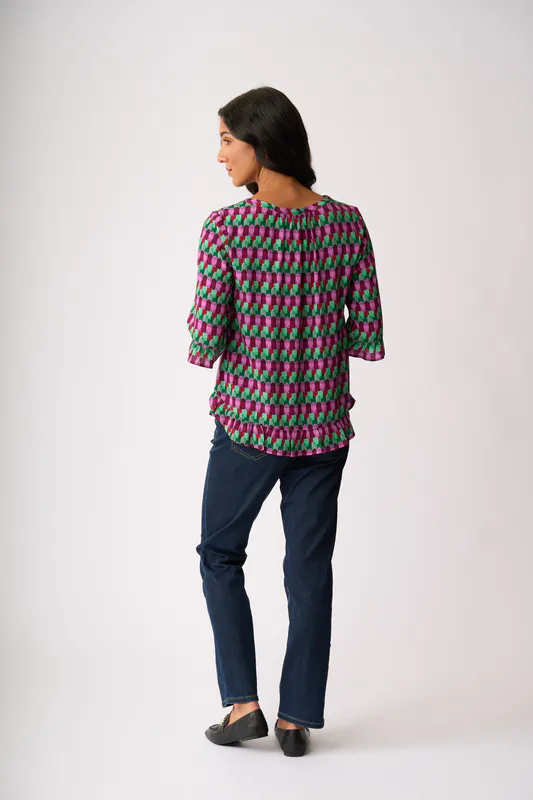 Model wearing Art Deco Gathered Scoop Hem Top By Foil Available at Beetees Nelson