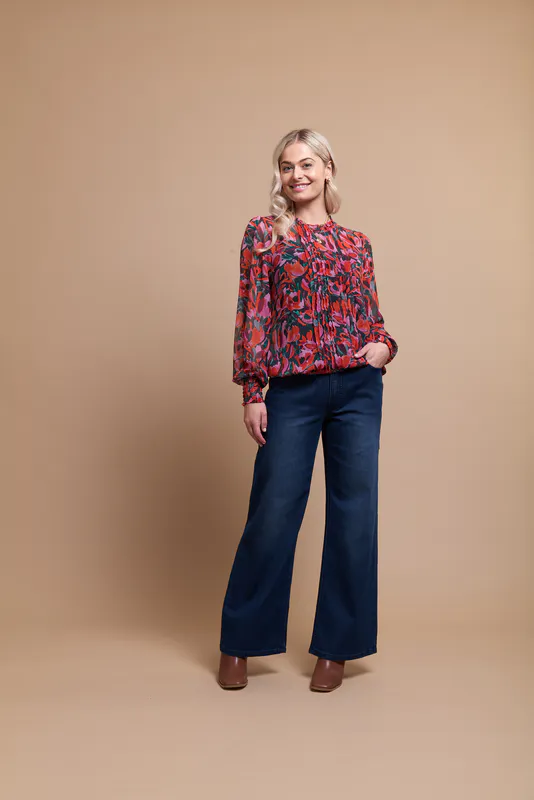 Model wearing Wonder Blooms Coloured BLOUSE - PINTUCK FRONT, SHIRRED CUFF By Memo ( Available in Starlight Blooms and Emerald Pop Coloured Only) at Beetees Nelson