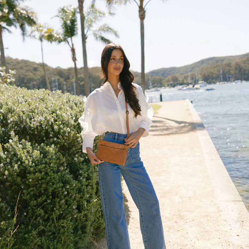 Model wearing Tan Nina Tan Crossbody/Clutch By Black Caviar Available at Beetees Nelson