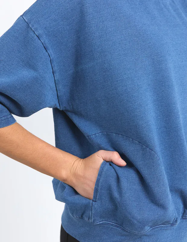 Model wearing Washed Blue Mazie Sweat - Denim Look By Elm Available at Beetees Nelson