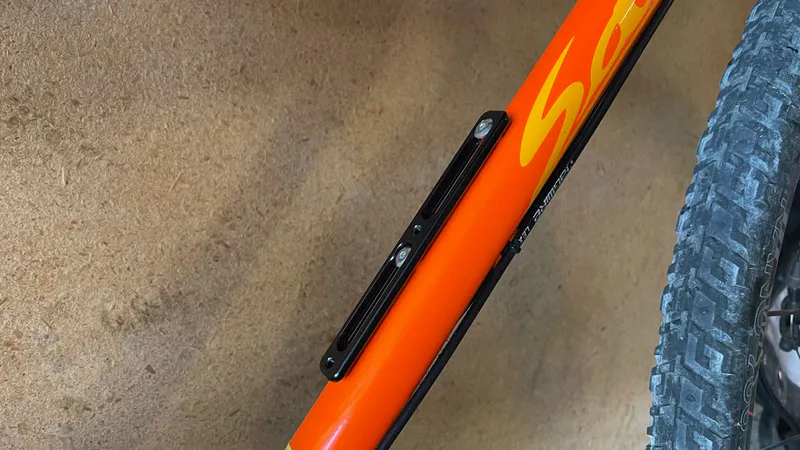 After adaptor installation, bottle cage repositioned 52mm toward BB.