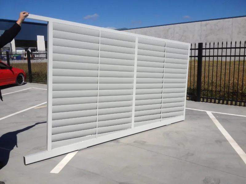 A louvre slider with a sloping bottom to match the slope of the driveway it will be installed on