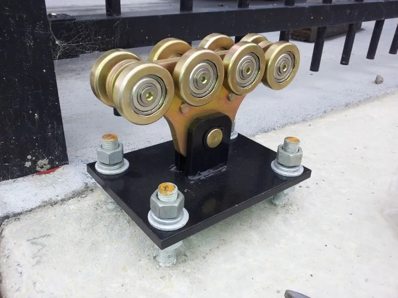 One of the cantilever wheel sets. Each gate comes with two of these. They fit inside the special steel cantilever wheel channel at the bottom which the aluminium main part of the gate is bolted to.