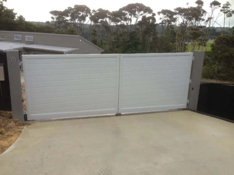 Horizontal tongue and groove - Double Swing gates - in this case also with a sloping bottom to match slope across the driveway