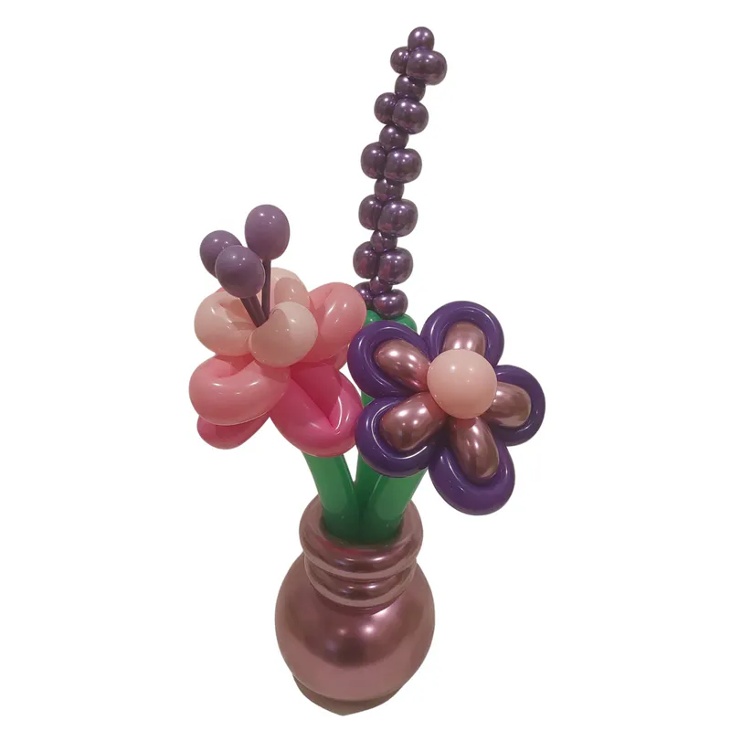 A balloon vase with three variations of flowers approximately 35cm tall with 15cm weighted base