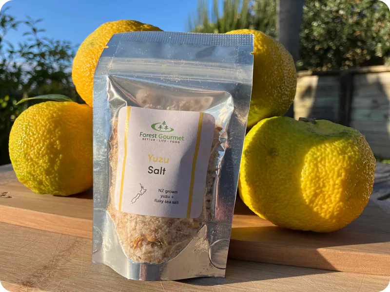 Yuzu Salt pouch with background of actual Yuzu fruit