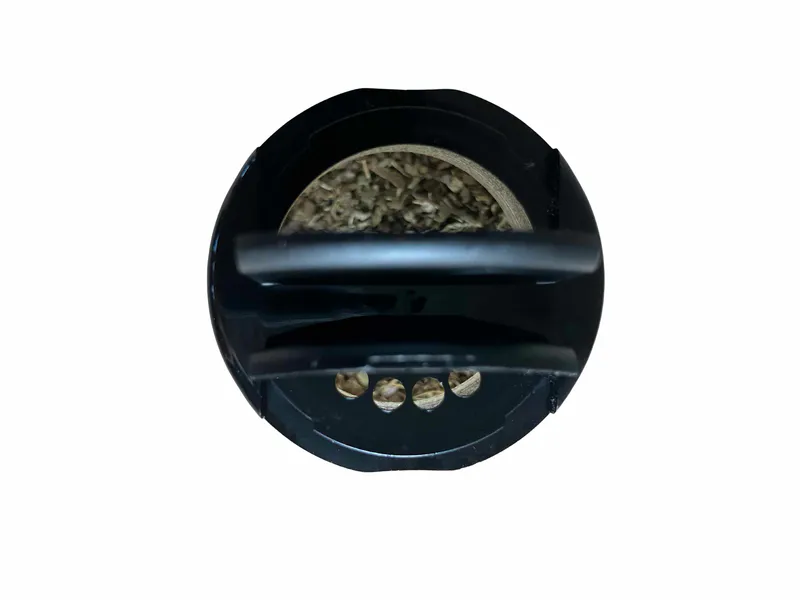 Dried horopito shaker bottle showing both sides of dual lid open