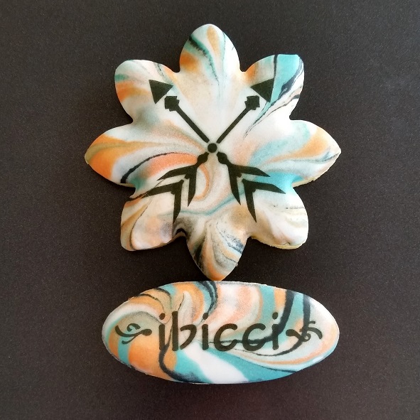 ibicci marbled cookie with stencilled Crossed Arrows