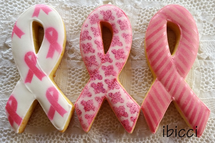 three pink breast cancer awareness cookies 
