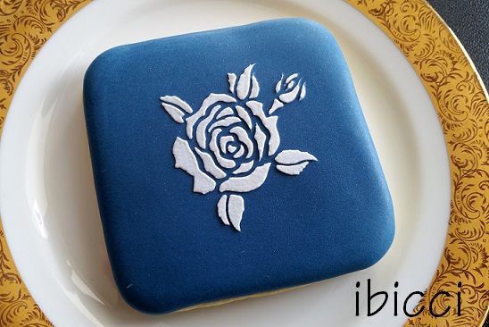 White rose on blue background cookie using the ibicci Rose with bud stencil