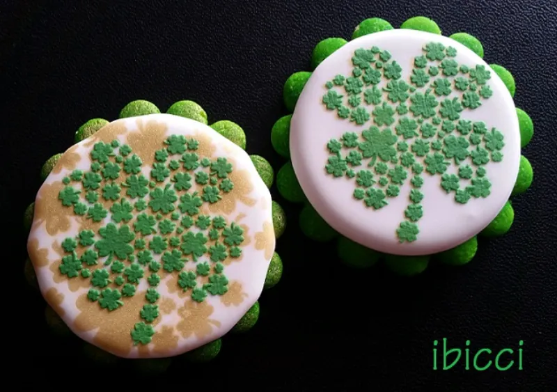 ibicci Clover cookie using the Cake Clover stencil airbrushed in gold then the cookie stencil in green Royal icing