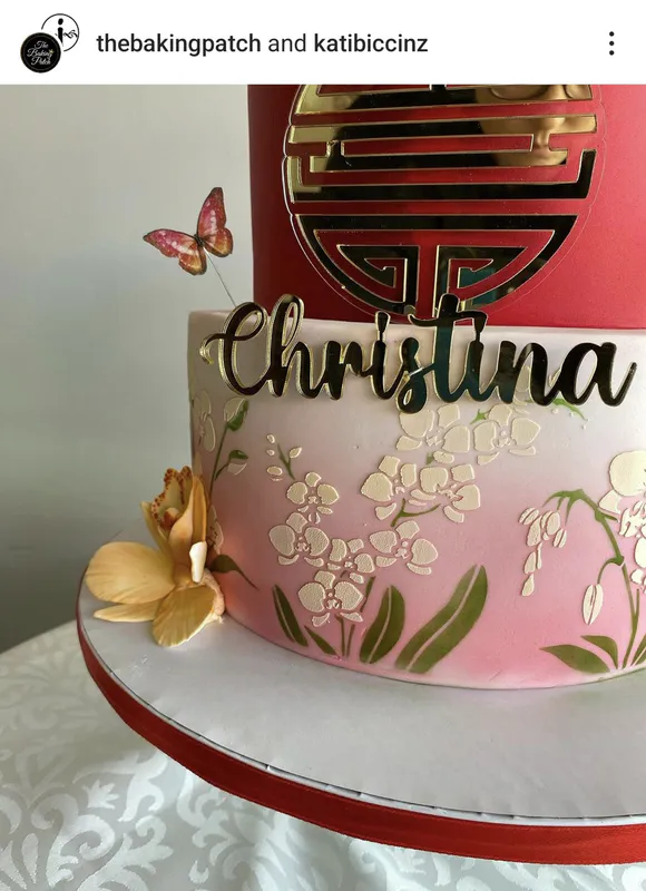 Close up of The Baking Patch cake using the ibicci 3 Orchid Panel stencil in 2 parts