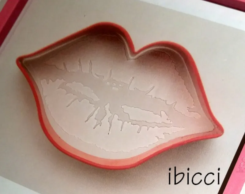 ibicci Full Lips stencil shown over the Wilton Lips cutter