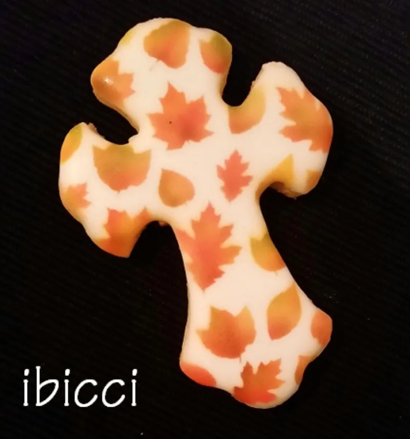 Decorated Cross cookie using the ibicci Autumn Leaves stencil