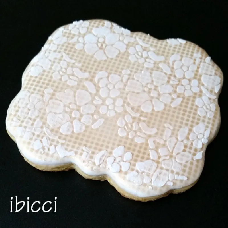 ibicci Cookie showing the Chantilly Lace stencil over a mesh base