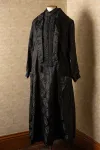 Black dress displayed on dress form