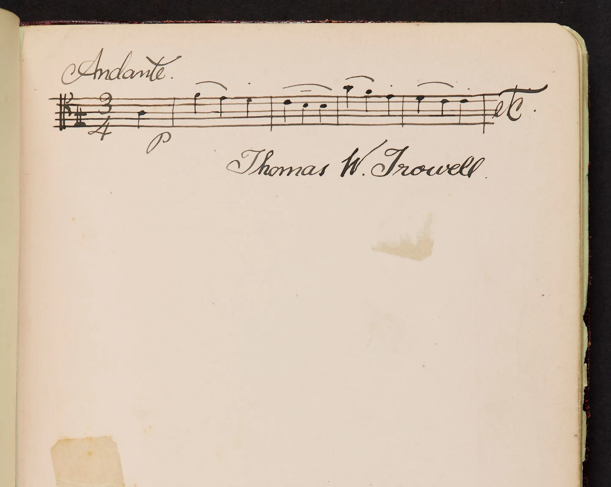 Notebook page with a handwritten bar of music and the words 'Andante' above left and 'Thomas Trowell' below right