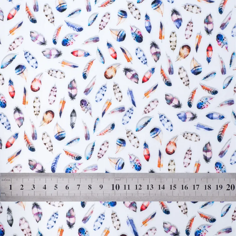 'Fluttering Feathers' fabric swatch with ruler for size reference