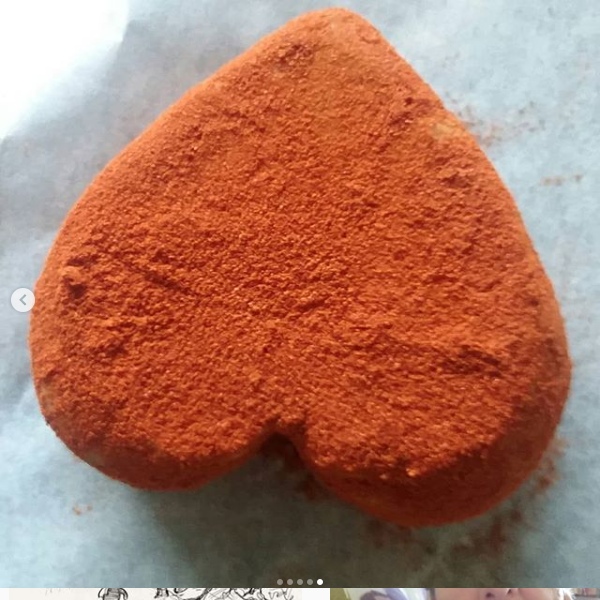 Image of heart shaped seed cheese with smoke paprika coating