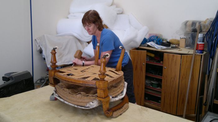 Nicky Neiman stripping an antique chair ready to go to the polisher