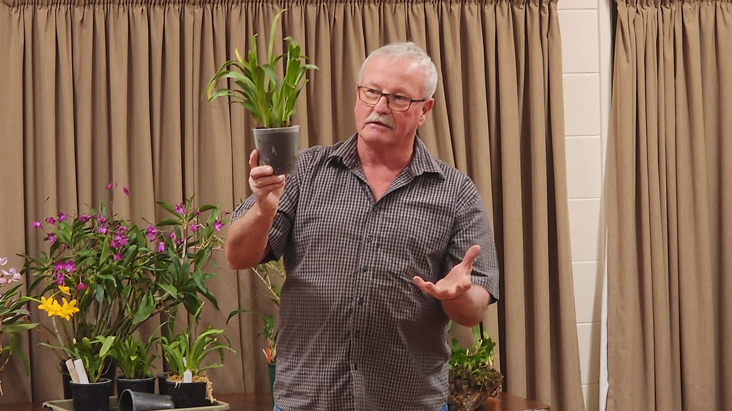 Allan Benson sharing tips on orchid growing