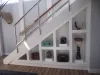 Timber Joinery projects - inbuilt shelving under staircase - by Orange Joinery