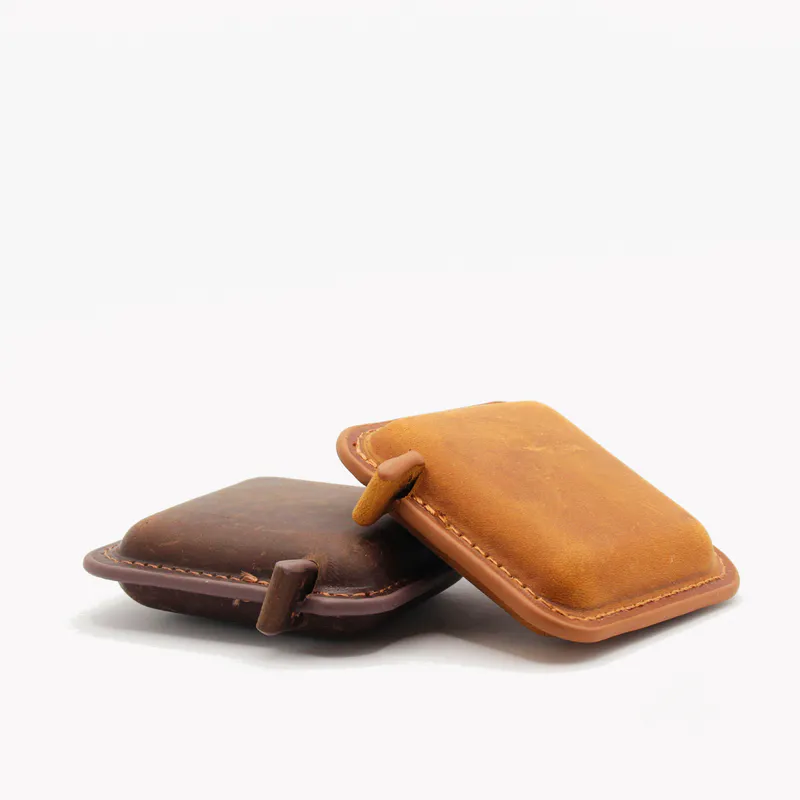 Two leather bound tape measures. They are self retracting.