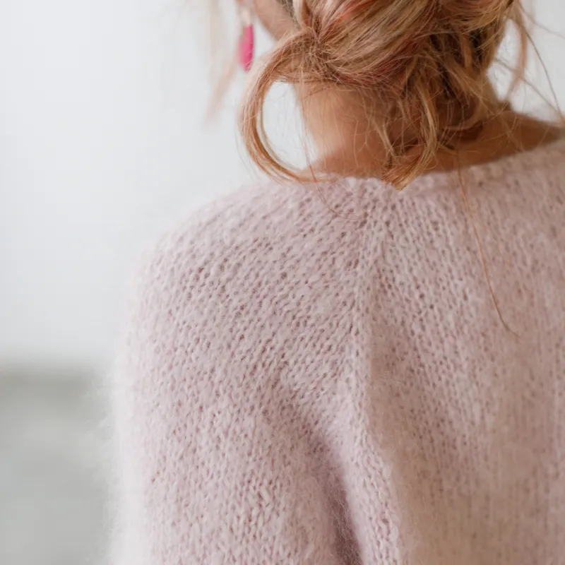 Back raglan seam of a top down, hand knit, mohair cardigan