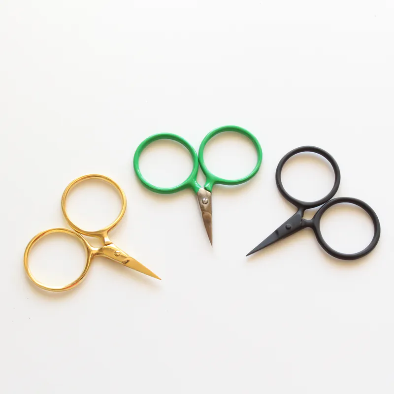 Three little scissors with oversized circle handles