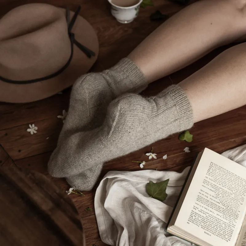 The underside of some cosy hand knit ribbed socks