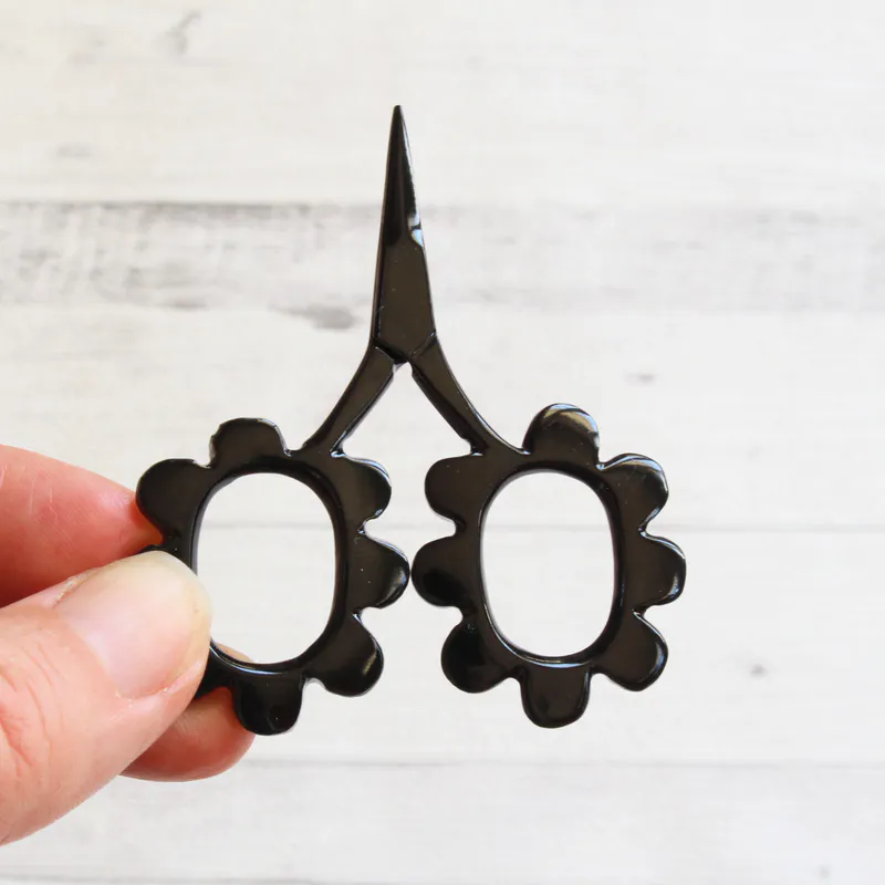 Black flower shaped scissors