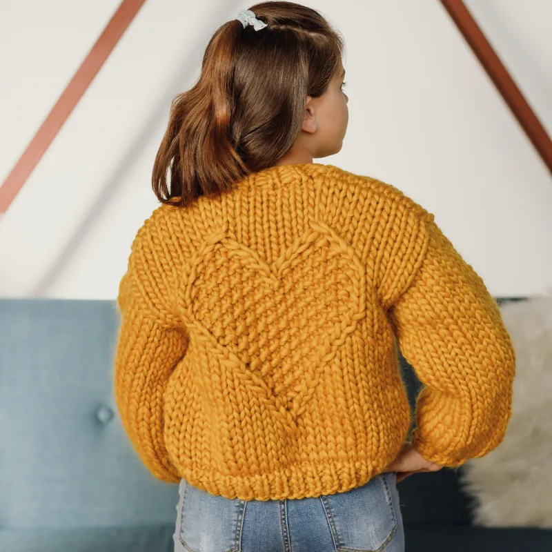 Back view of the Mini Love Bomber knitting pattern in yellow