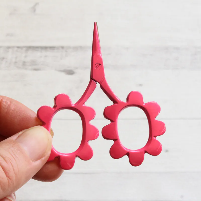 Bright pink flower shaped scissors