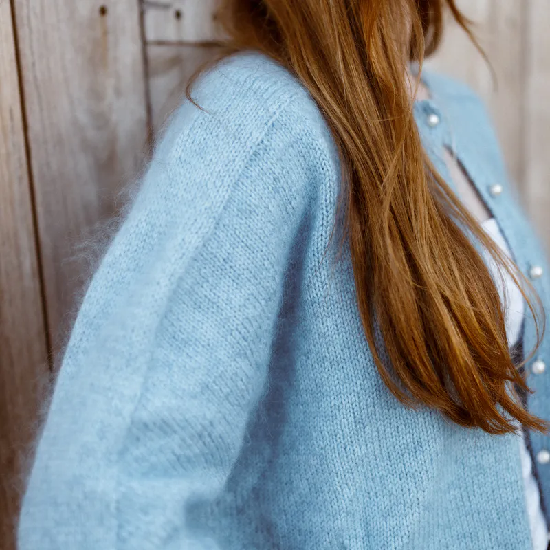 A close up of the sleeve on the Ridgeline Cardigan knitting pattern. It has a seamless construction with no sleeve pick up line!