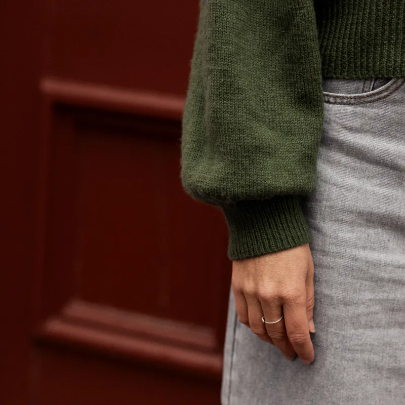 Cuff detail on the Gather Sleeve Cardi knitting pattern. The edge is bound off using Italian Bind off method.
