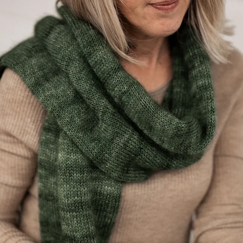 A hand knit scarf knit in circles to create a long tube. It's extra thick and warm for winter