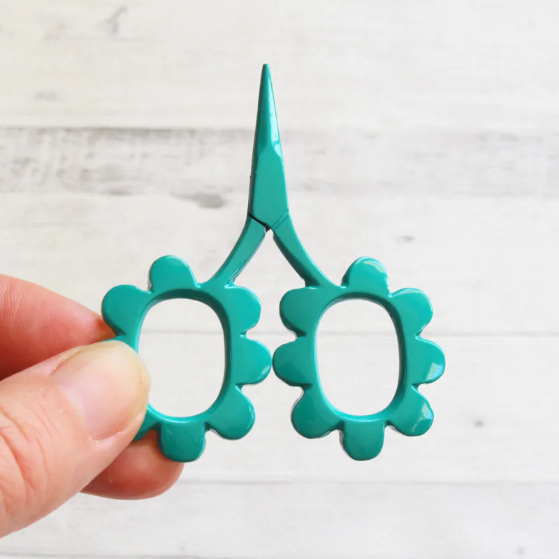 Teal flower shaped scissors