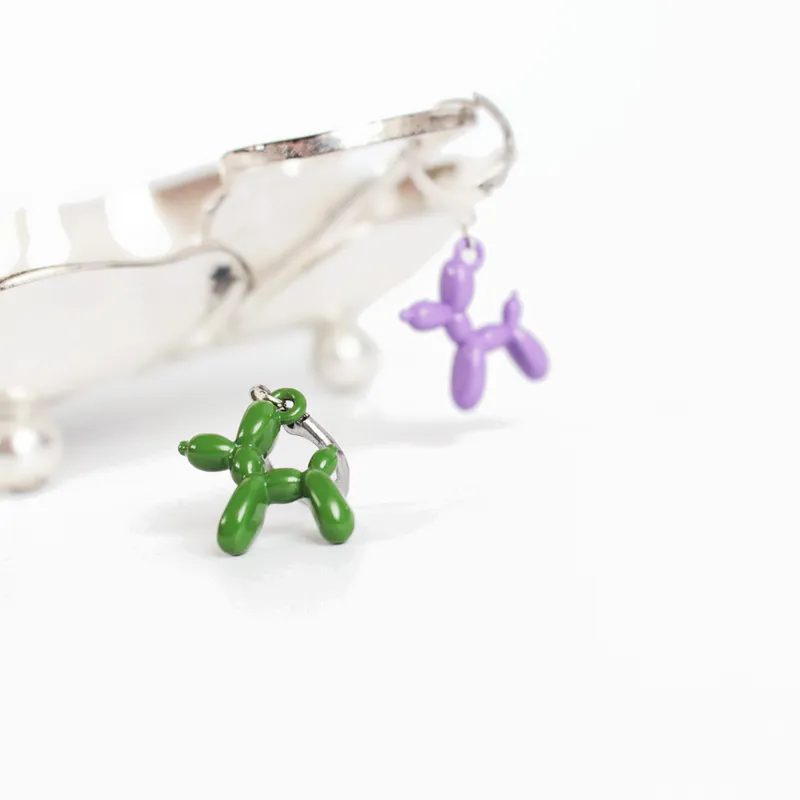 Metal knit stitch markers in the shape of balloon animals.