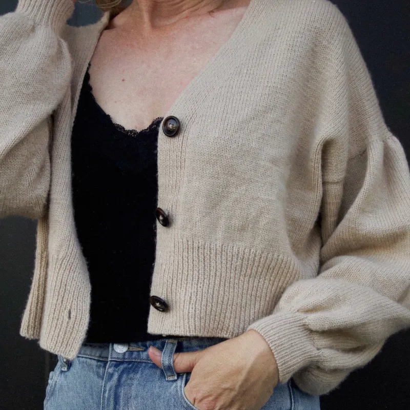 Gather Sleeve Cardi knitting pattern in a tan colour with the buttons open