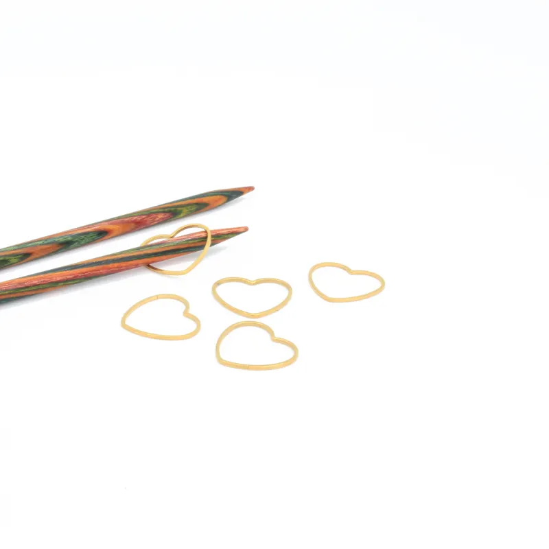 Seamless, gold coloured stitch markers in a heart shape